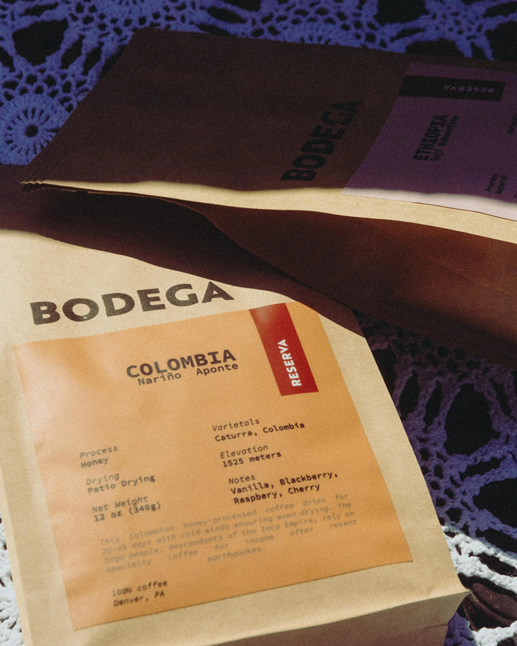 A bag of Colombia Nariño Aponte coffee from Bodega Coffee Roasters, with clean, modern packaging displaying origin information, photographed in a warm, natural setting.