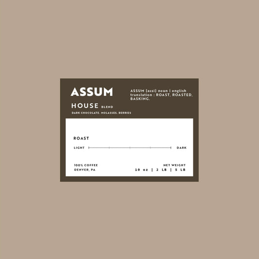 Assum coffee label on a beige background
House blend that has notes of Dark Chocolate, Molasses, and Berries.