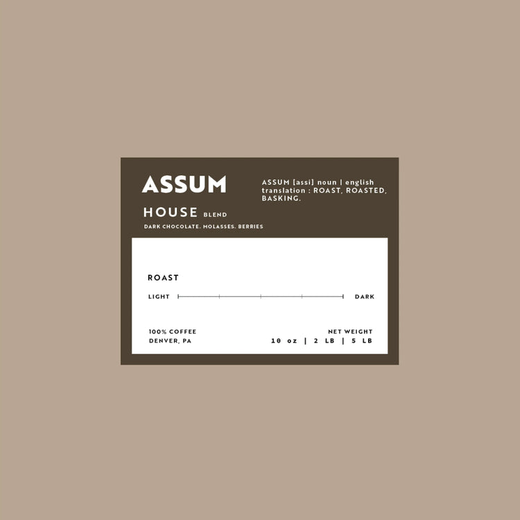 Assum coffee label on a beige background
House blend that has notes of Dark Chocolate, Molasses, and Berries.