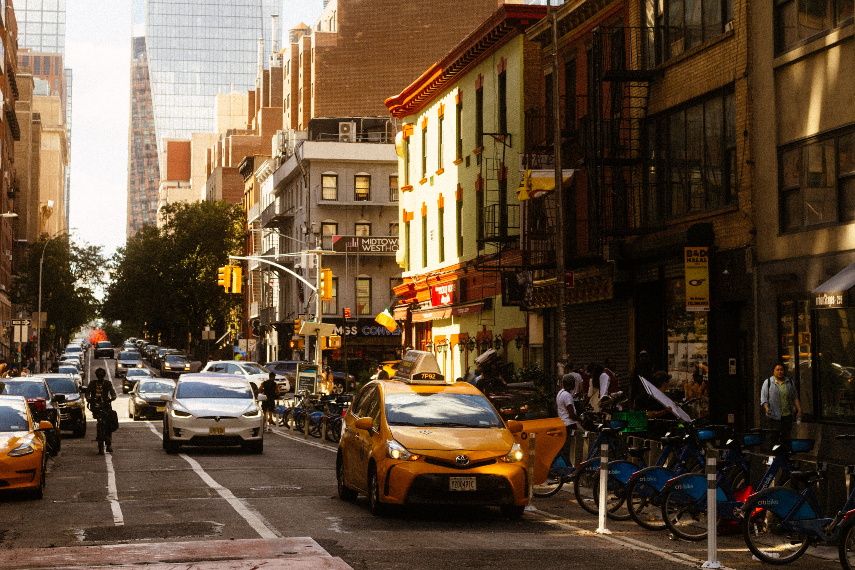 Cars and taxi on a busy street