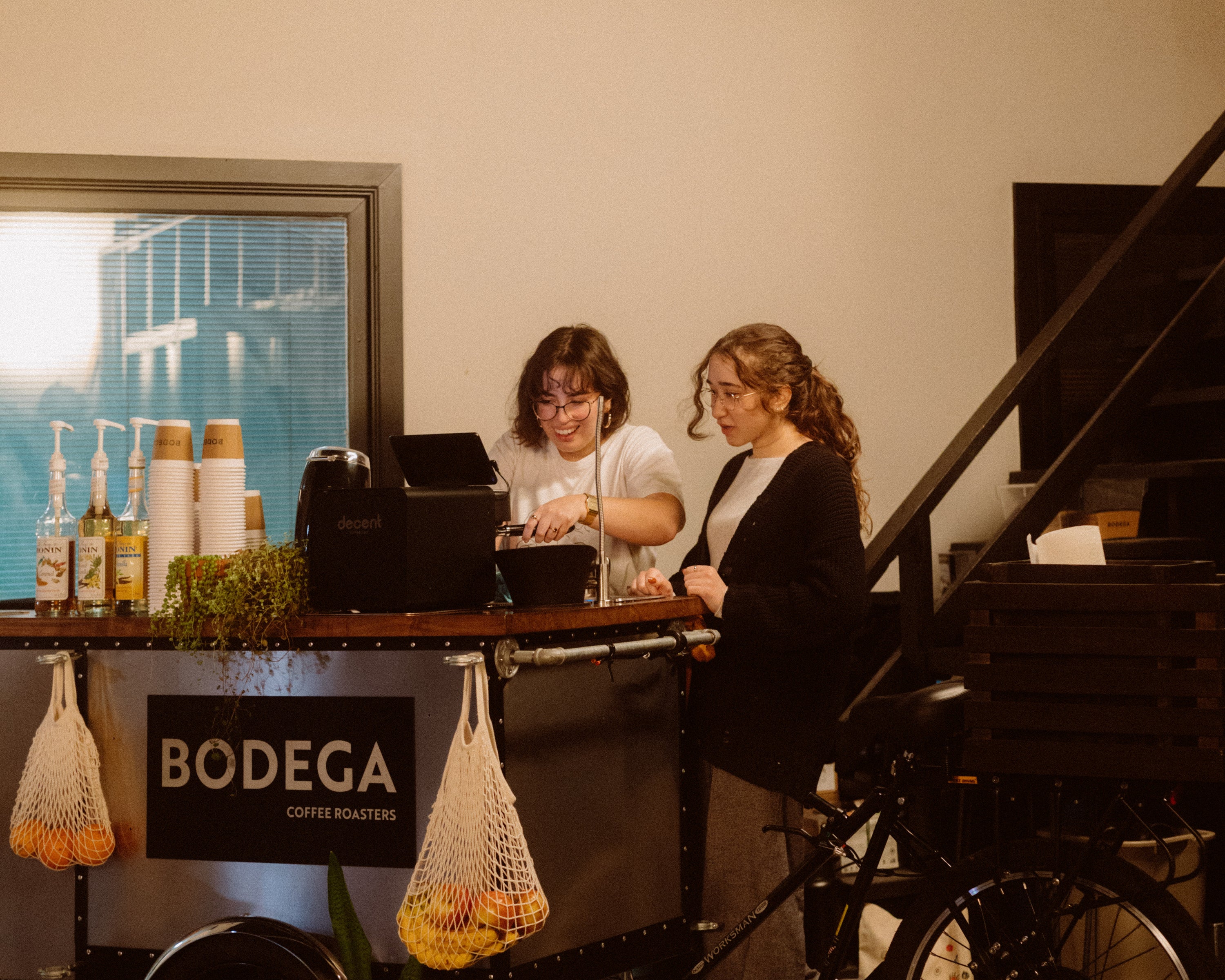 Bodega trike being managed by two girls