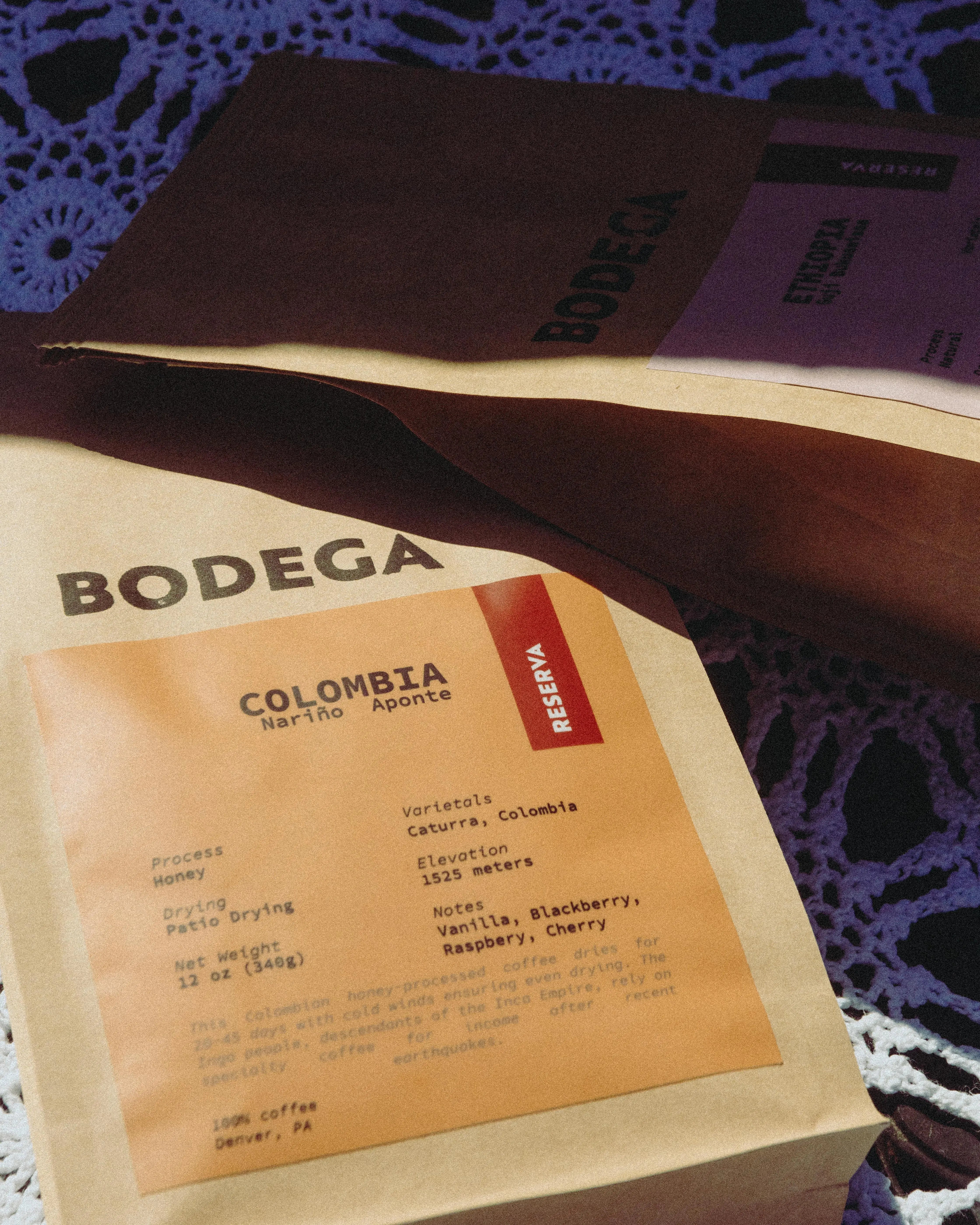 A bag of Colombia Nariño Aponte coffee from Bodega Coffee Roasters, with clean, modern packaging displaying origin information, photographed in a warm, natural setting.