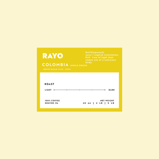 Coffee label for 'Rayo Colombia' on a light yellow background