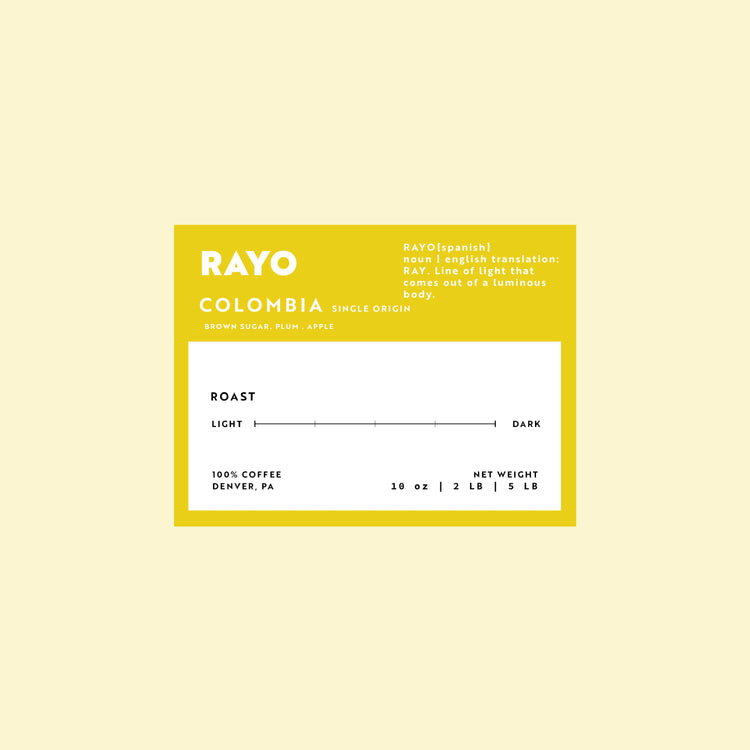 Coffee label for 'Rayo Colombia' on a light yellow background